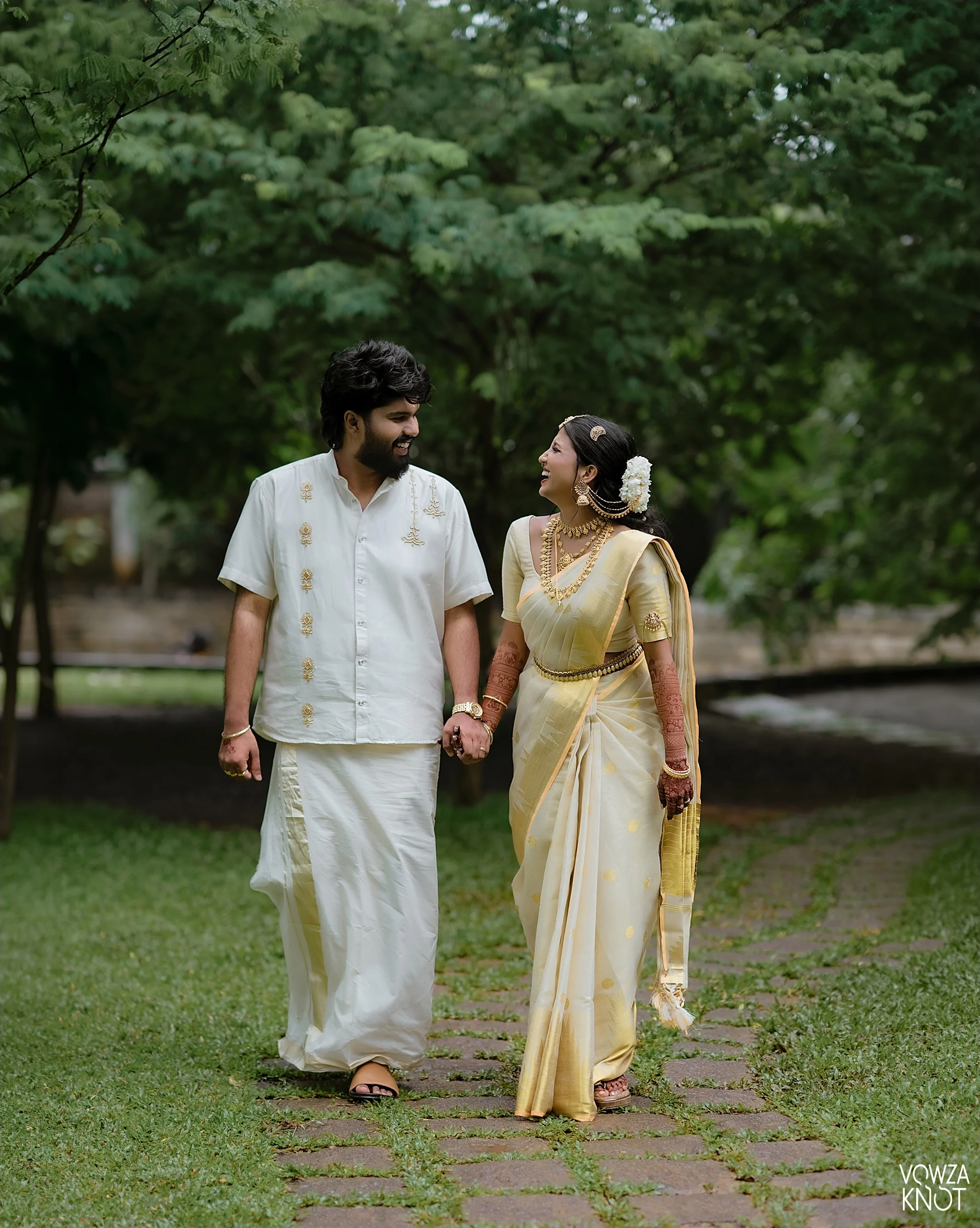 A richly designed wedding celebration beneath red drapery